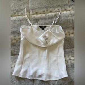 Beautiful white Express top. Light and shimmery material. Brand new with tags!